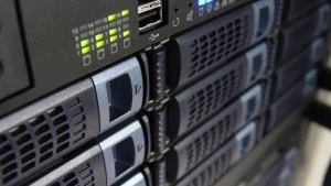 Close-up of rack-mounted servers with green and blue status lights